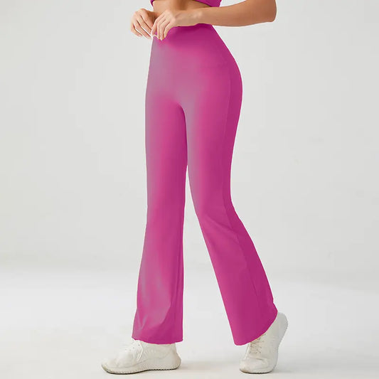 Model wearing XFyt Berry pink flared yoga pants