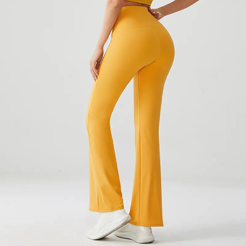 Yellow pants worn by a person on a white background