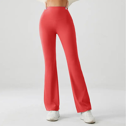 Red flared pants worn by a person on a light gray background